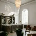 166 transparent spiral prism Murano chandelier hanging in a bar