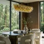 138 amber poliedri chandelier hanging in diningroom in house with a view