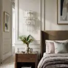 18 transparent tube sconces hanging in bedroom