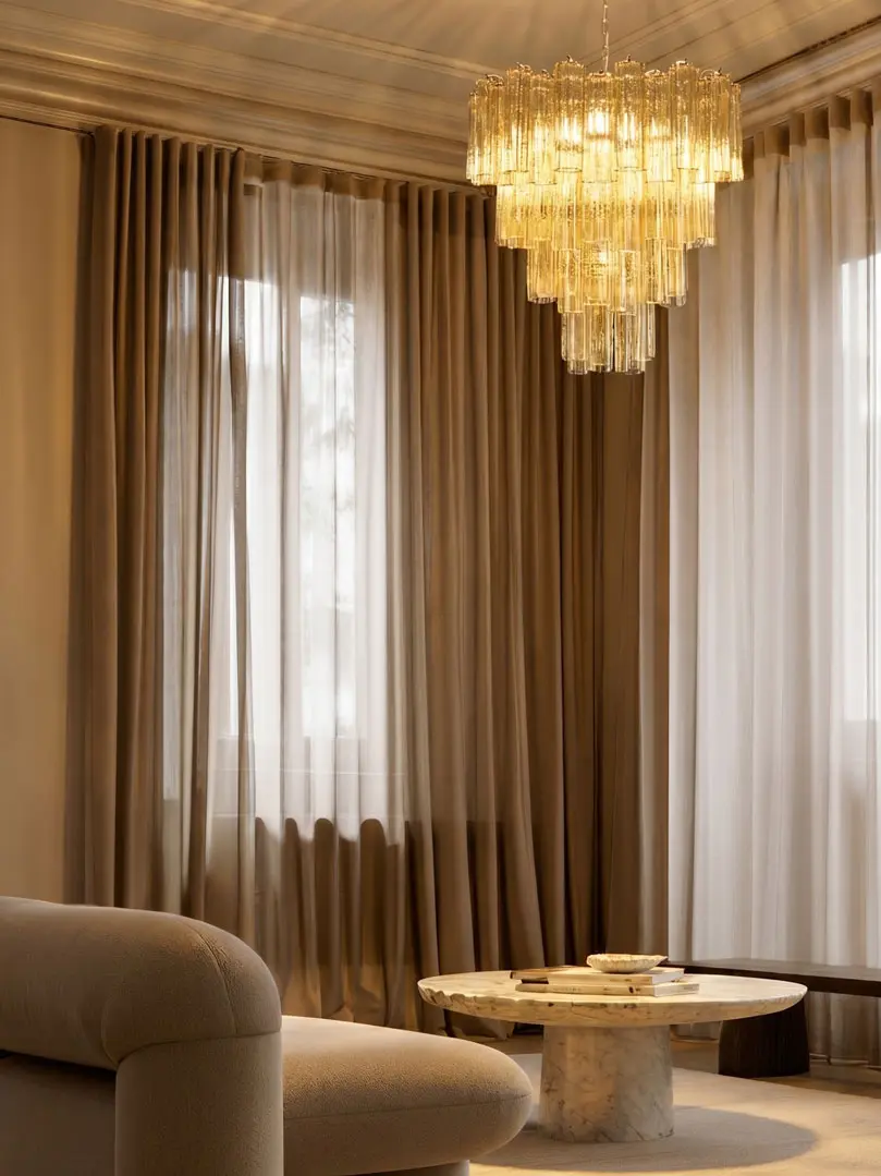 80 clear amber Murano tube chandelier hanging in livingroom