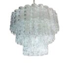 Italian chandelier in Murano glass and nickel-plated metal structure, with 52 large clear glass tubes, with an effect in the glass that creates an 'ice'-like chandelier. The lamp is supplied with chain and ceiling canopy. If you want your lamp frame in gold, just write to us at