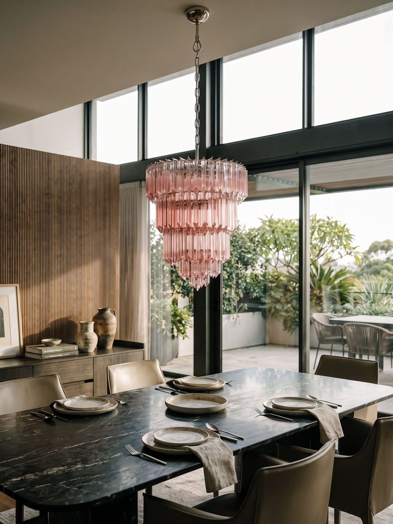 112 pink prism Murano chandelier hanging in a dining room