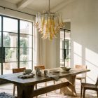 53 amber petals chandelier hanging in a diningroom